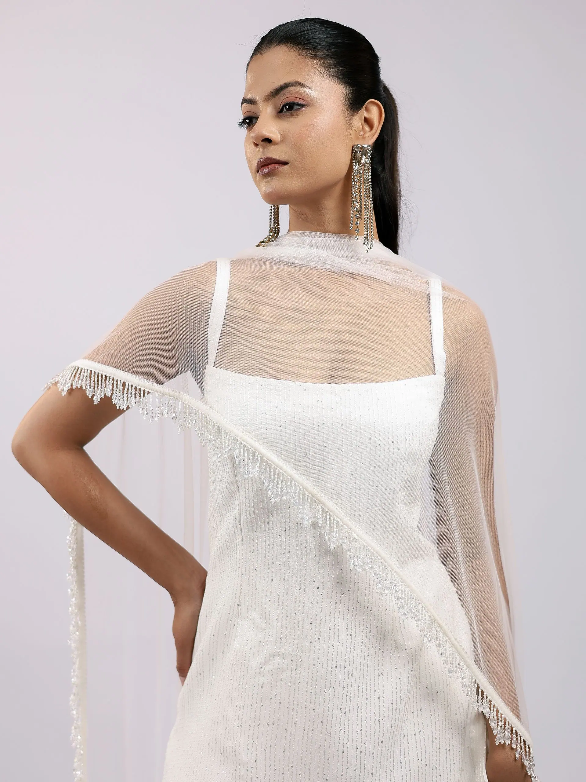 Pearl-fringe dupatta draped over the ivory kurta, close portrait